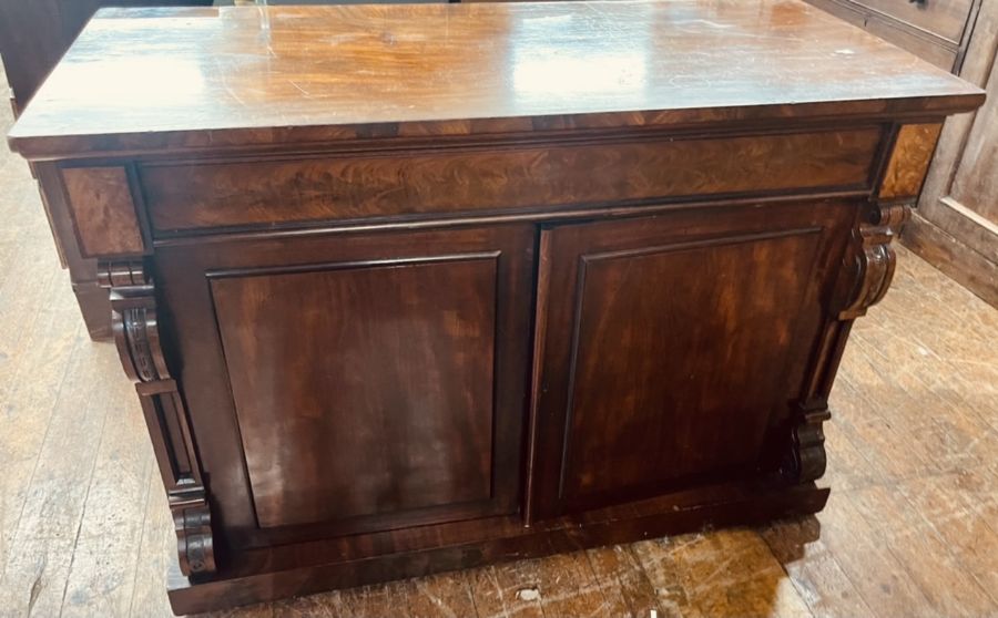 A Victorian mahogany chiffonier, circa 1850, slight oversailing top, above a long frieze pine