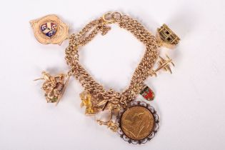 A double chain charm bracelet in rose-yellow metal stamped 9ct 375, linked to 8 charms. The charms
