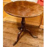 A George III and later tilt top table, circular top, turned column, raised on tripod cabriole legs