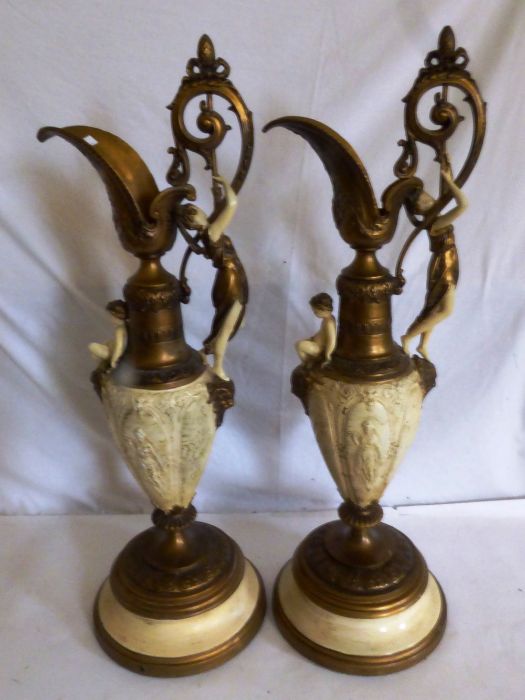 A pair of late 19th century gilt and cream finished spelter Renaissance style ewers, cast with - Image 3 of 4