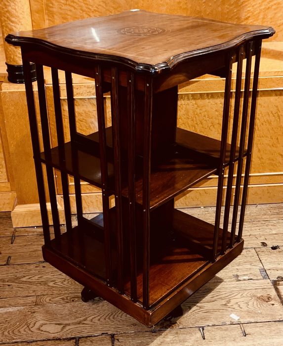 An Edwardian mahogany, marquetry strung and ivory foliage revolving bookcase, circa 1910, in