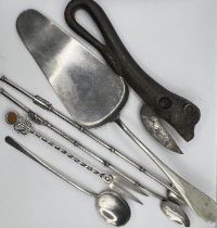 A selection of interesting white metal items including scarab cocktail stirrer/straws in the Art