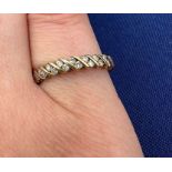A 9ct gold diamond half hoop ring, containing 18 round brilliant cut diamonds. Total estimated