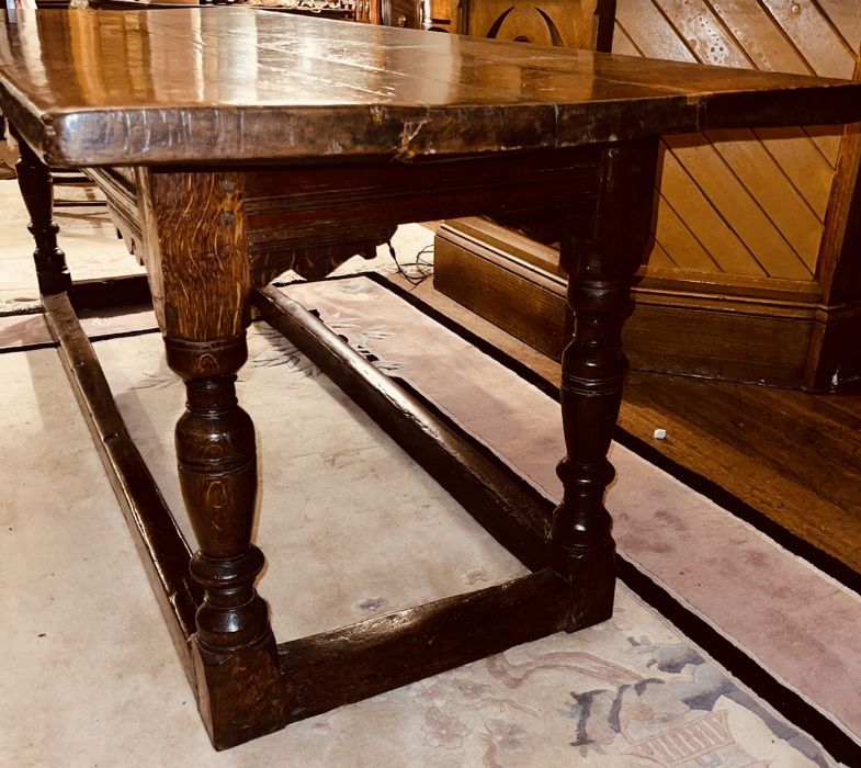 A Charles I oak refectory table, circa 1630, two plank top, raised on baluster on block supports - Image 3 of 6