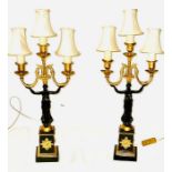 A pair of empire style candlesticks (2)