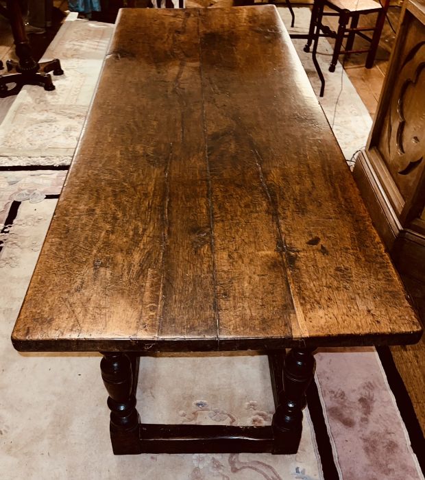 A Charles I oak refectory table, circa 1630, two plank top, raised on baluster on block supports - Image 2 of 6