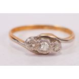 An early 20th century diamond trilogy ring, in yellow metal stamped 18ct Plat. Gross weight