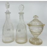 A pair of early 19th century glass spirit decanters and stoppers with etched foliate and fluted