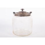 An Edwardian sterling silver lidded, cut glass, biscuit barrell. With engraved dedication to