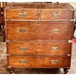 A Victorian mahogany and brass bound campaign chest, two short and three long drawers, raised on