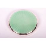 A pale green guilloche enamel topped compact in sterling silver Hallmarked for Adie Brothers Ltd,