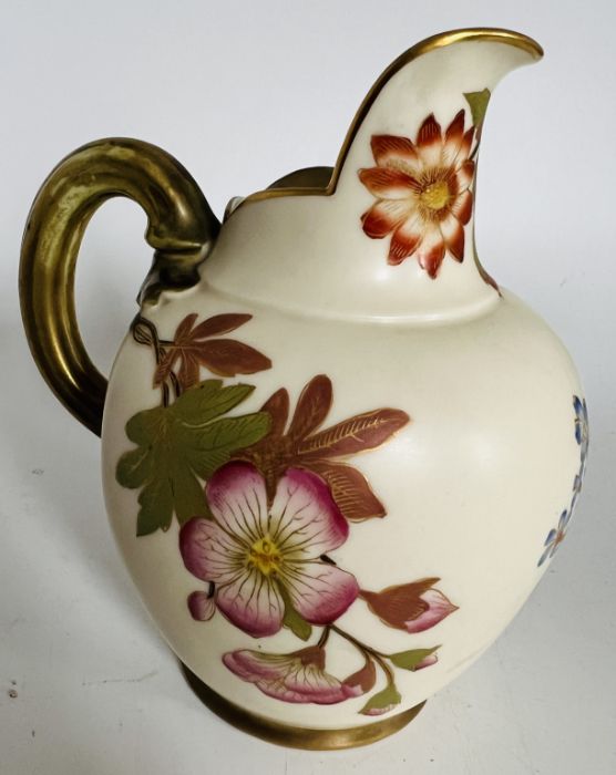 A Royal Worcester blush ivory jug painted with flower sprays, gilt highlights, pattern 1094, 14cm