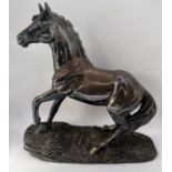 A Tom Mackie design silver horse on filled naturalistic base by H.L. Sheffield 1987, 15.5cm high