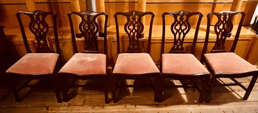 A set of ten Thomas Chippendale influence mahogany dining chairs (3x carvers & 7 chairs), curved top