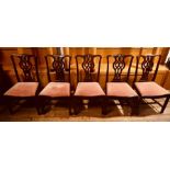 A set of ten Thomas Chippendale influence mahogany dining chairs (3x carvers & 7 chairs), curved top
