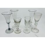 A pair of 19th century ale flutes, an 18th century design wine glass, the trumpet bowl with etched