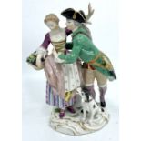 An early 20th Meissen porcelain figure group in 18th century style, he in green frock coat, she in