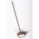 An Elizabeth II sterling silver hand raised toddy ladle. In the Old English revival style,