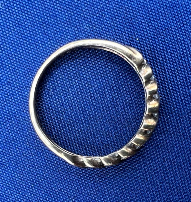 A 9ct gold diamond half hoop ring, containing 18 round brilliant cut diamonds. Total estimated - Image 4 of 5