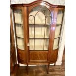 A late Victorian mahogany and satinwood strung display cabinet, bow front with an arch moulded