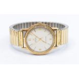 Omega- a gents 9t gold Automatic Seamaster wristwatch 9ct gold watch, comprising a round silvered