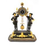 A French spelter two train clock under a large glass dome, movement contoured on a large sphere over