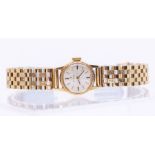 Omega- a ladies 9ct gold Omega wristwatch, comprising a round silvered dial with applied gilt