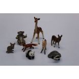 A group of Beswick animal figures comprising a foal, tail down H9cm, a giraffe H18.5cm, a Donkey