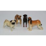 A group of four Beswick figures, a Boxer, H14cm, a Doberman, H14.5cm, an Afghan Hound and a pug,