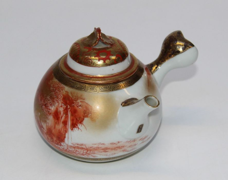 A 20th century Japanese kutani-type porcelain teapot and cover decorated in iron red and gilt with