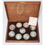 Set of nine Sterling silver medals Queens of the British Isles in wooden case