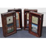 Four, late 19th century American walnut cased drop dial wall clocks, each with gong striking