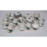 A mid 20th century Lubern China part tea service, decorated with Lily of the Valley, with gilded