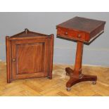 A Victorian mahogany side table fitted with a drawer, raised on faceted column and platform base and