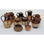 A collection of Royal Doulton, Lambeth and other stoneware including coffee pots, jugs, tobacco jar,