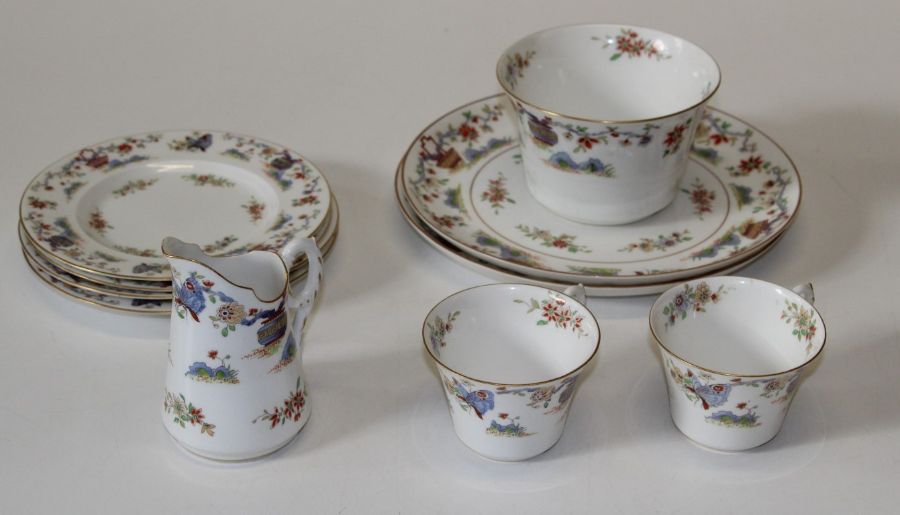 An early 20th century Royal Worcester tea service, comprising twelve tea cups, eleven saucers,