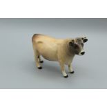 A Beswick figure 1422 of a Jersey Bull ' Dunsley coy boy' H12cm