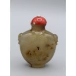 Snuff Bottle. Chalcedony of compressed baluster shape, with flared neck and a neatly formed