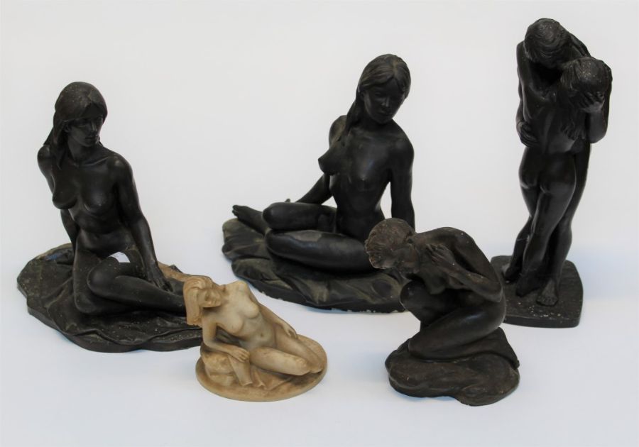 Four bronzed plaster moulded nude studies together with a resin cast model. The largest, 34cm