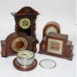Five various clocks comprising a Smiths ship clock, an oak cased Art Deco three train mantel
