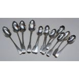 Four silver serving spoons, approximate weight 241gm plus nine dessert spoons, approximate weight
