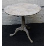 A 19th century cream painted oak tripod table, the circular snap top on turned column, downswept