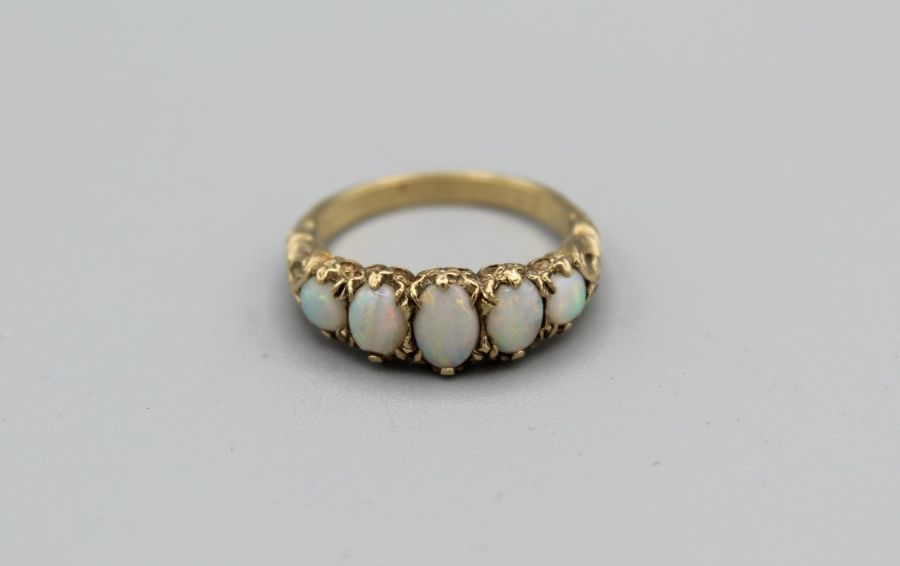 A 9ct yellow gold Opal set Victorian style half hoop ring. Hallmarked London 1989. Gross weight