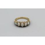 A 9ct yellow gold Opal set Victorian style half hoop ring. Hallmarked London 1989. Gross weight