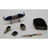 An early 20th century silver chick pin cushion, London import marks, 3cm together with a silver boot