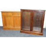 An Edwardian light oak cupboard, the rectangular top over two frieze drawers with brass drop handles