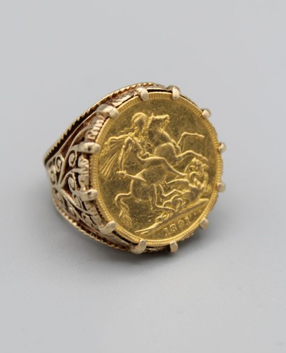 An 1891 Victoria sovereign ring in a yellow metal mount stamped 9ct, gross weight 14.8gm