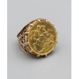 An 1891 Victoria sovereign ring in a yellow metal mount stamped 9ct, gross weight 14.8gm