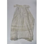 A cotton and lace child's gown, having decorative trimmed collar and sleeves, early 20th century,