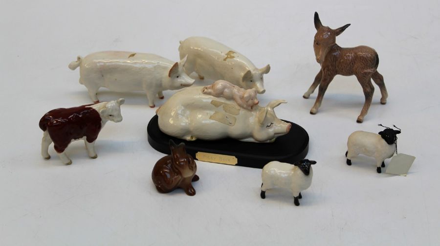 A group of eight Beswick farm figures comprising a black faced ram, H8cm, a black faced lamb,